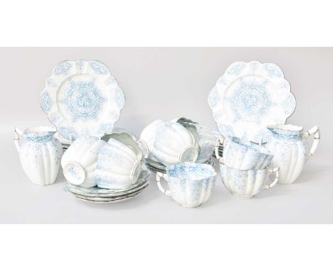 A Wileman &amp; Co. Foley Porcelain Tea Set, "Trailing Daisy" pattern in blue, comprising: 11 cups, 7 saucers, 13 side plates