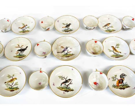 After Meissen a Set of Twelve German Porcelain Teacups and Nine Saucers, circa 1770, painted with birds in branches within gi