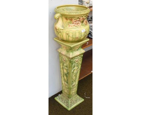 An Ault Pottery Jardinière and Similar Stand, the Jardiniere moulded with fruit, twin fishtail moulded handles, egg and dart 