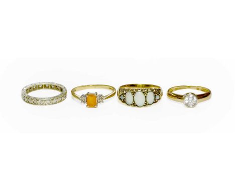 A 9 Carat Gold Fire Opal and Diamond Ring, finger size N; An Opal Five Stone Ring, stamped '375', finger size N; A 9 Carat Go
