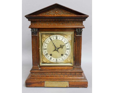 A German Oak Quarter Striking Table Clock, circa 1900, with presentation plaque, backplate stamped W &amp; H, 41cm high