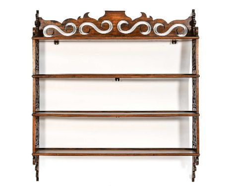A Set of Victorian Carved Walnut Hanging Shelves, late 19th/early 20th century, of four tier form, the scrolled and pierced t