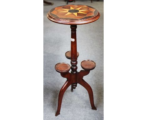 A 19th Century Inlaid Tripod Table, the parquetry inlaid circular top on a tapering turned support issuing three arms and rai