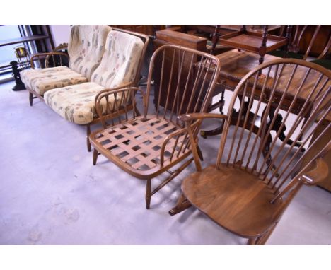 A modern Ercol lounge suite in mid to dark colour comprising two settees, armchair and rocking chair