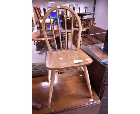 A 1960's Ercol light elm stick/hoop back chair, impressed BS JK mark to underside