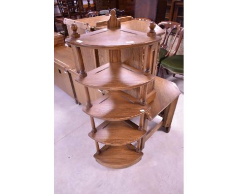 Three modern Ercol dark to mid stain corner shelves