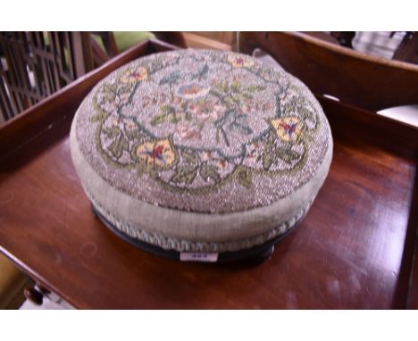 A Victorian beadwork footstool, diameter approx. 30cm