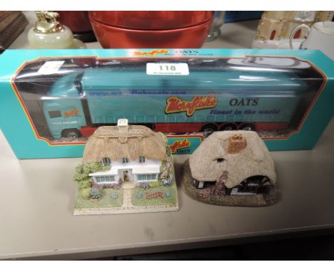 A die cast model truck for Mornflakes by Corgi and two Lilliput lane houses