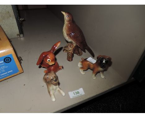 A Beswick song thrush,Goebel rabbit with lady bird on tail and two boxer dog figurines.