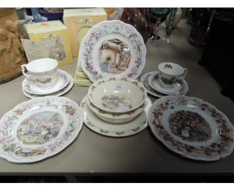 A collection of Royal Doulton Brambly hedge plates and cups and saucers, also included in a Bunnykins set.