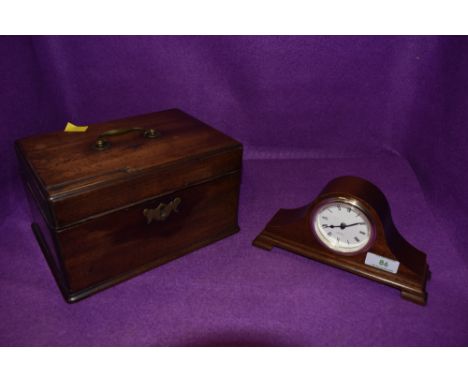 An antique mahogany veneered tea caddy having three internal compartments and a small Mahogany mantle clock.