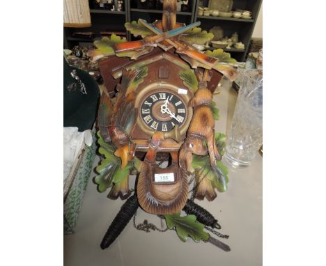 A German cuckoo clock having hunting theme.