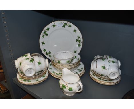 An assortment of Colclough china including cups and saucers,plates,bowls, jug and sugar basin.around thirty three items.
