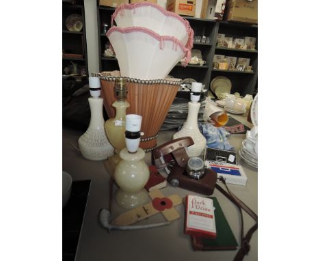 A selection of vintage lamps and shades,Tasco Binoculars, a Halina camera,Park Drive advertising playing cards and more.