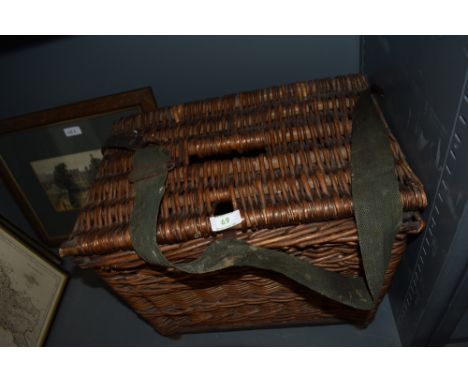 A large vintage fishing basket.