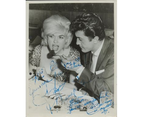 Jayne Mansfield signed b/w vintage candid 10x8 seated alongside the singer Nelson Sardelli. Dedicated. 10x8 Inch. Good condit