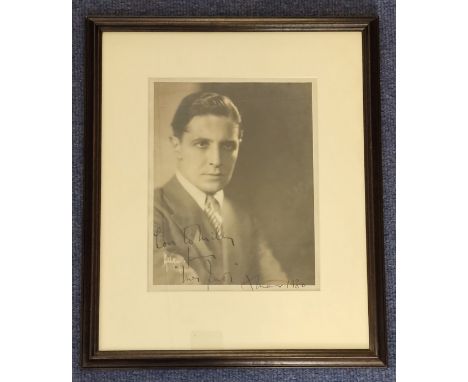 George Murphy signed vintage black and white photo. Dedicated. 9.5x7.5 Inch Mounted in a black wooden framed to an overall 16