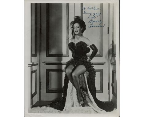 Dorothy Lamour vintage 10x8 full length pose in showgirl costume. Dedicated. 10x8 Inch. Good condition. All autographs are ge