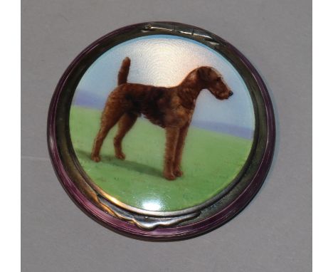 A 1930's silver-gilt and guilloche enamel circular compact, the hinged cover decorated with an Airedale Terrier, import mark 