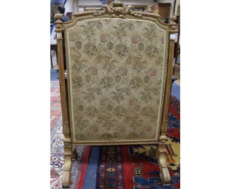 A late 19th century French giltwood firescreen 2ft 9in.
