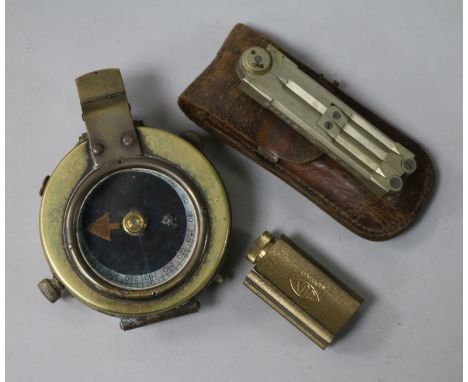 A military compass, a pair of dividers and a pencil sharpener (all leather-cased)