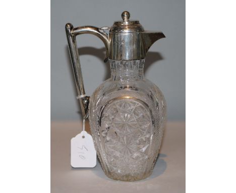 A late Victorian silver mounted cut glass claret jug, Edward Hutton, London, 1890, 23cm.