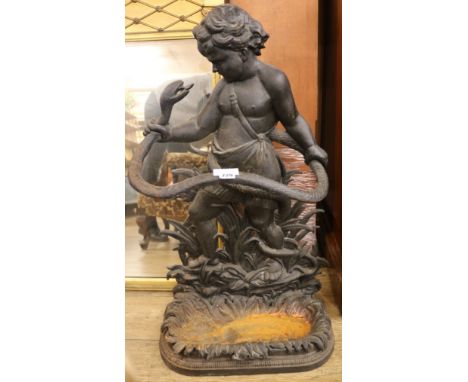 A cast iron youth and serpent stick stand, H.2ft 10in.