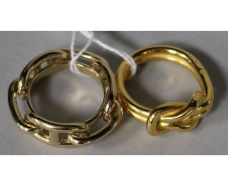 Two Hermes scarf rings.