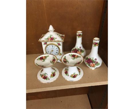 Selection of old country rose vase clock and candle stick