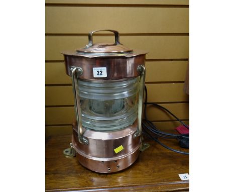 A polished copper & brass ship's mast head lamp converted to electricity E/T