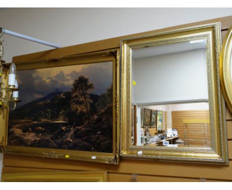 A modern gilt framed bevelled wall mirror together with a gilt framed print of cattle watering