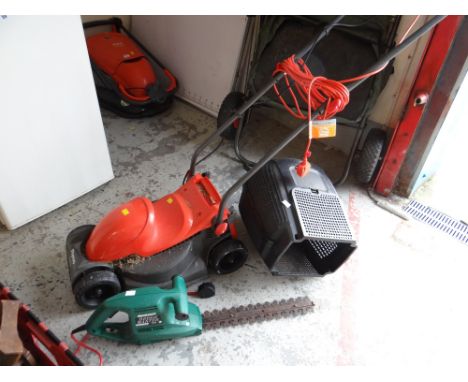 A Flymo rotary lawn mower together with a Qualcast hedge trimmer E/T