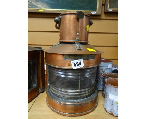 A polished copper mast head light converted to electricity E/T