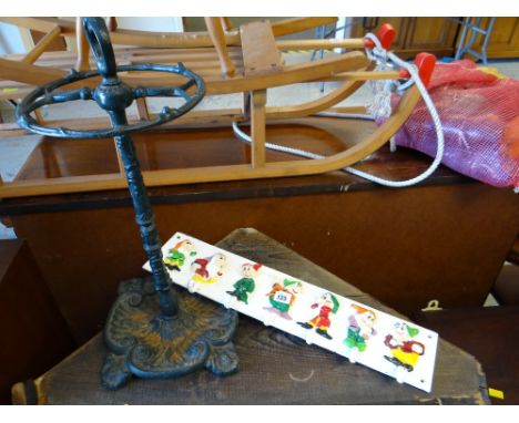 A small cast metal stick / umbrella stand together with a Seven Dwarfs coat hanger