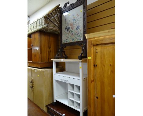 A small pine top kitchen storage unit together with a vintage carved firescreen