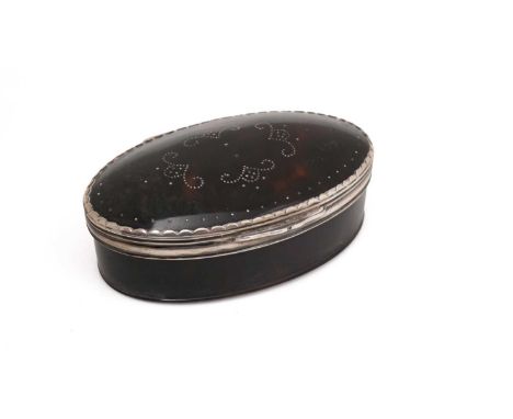 An early 18th Century silver mounted tortoiseshell snuff box, oval with a reeded, lappet border around the cover, pique-work 