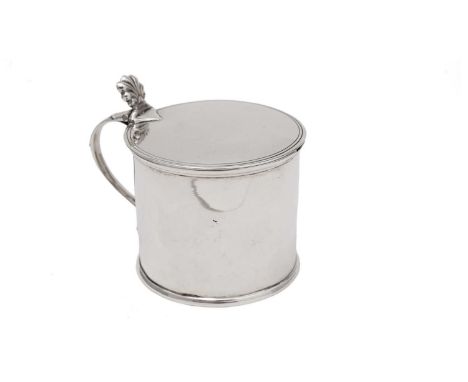 A George III provincial silver mustard pot, in the form of a plain drum with a shell thumbpiece and blue glass liner, by John