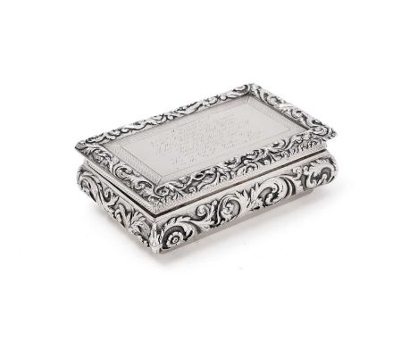 A William IV silver table snuff box, rectangular with convex sides, decorated with repousse work scrolling foliage and floret