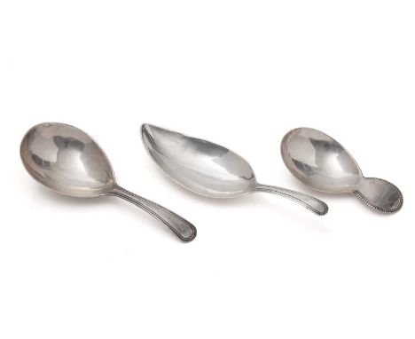 Three George III silver caddy spoons, with fine bead decorated stems (one initialled), two of them by Thomas Wallis and one w