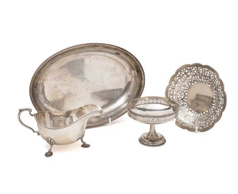 An Edwardian silver entrée dish base, oval, with a bead border, by R. Martin &amp; E. Hall, Sheffield 1901; a silver sauceboa