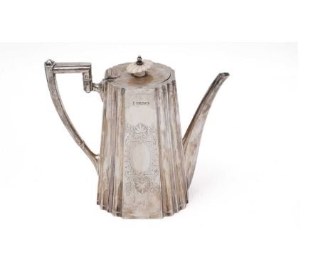 A Victorian silver coffee pot of tapering form, with panelled and fluted decoration, an engraved cartouche on each side, an a