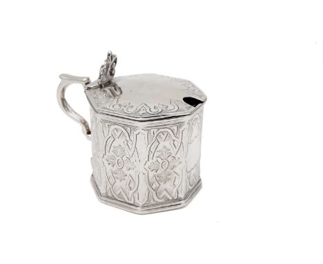 An early Victorian engraved silver mustard pot, with an octagonal body, pierced thumbpiece, and a scroll handle, crested, (bl
