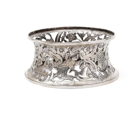 A George V silver dish ring in the 18th Century Irish manner of waisted form, pierced and chased with birds, flowers, fruit a