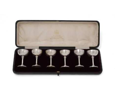 An Edwardian/George V cased set of six silver liqueur tots in the form of small goblets, crested, by Elkington &amp; Co, Birm