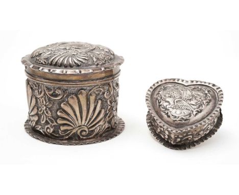 A late Victorian silver dressing table box, with embossed decoration, and a bayonet-fitting cover, monogrammed, by A &amp; A.