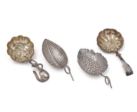 Four antique silver, Birmingham-made caddy spoons:- a leaf spoon by Joseph Taylor 1801, a leaf spoon with grapes by Joseph Ta