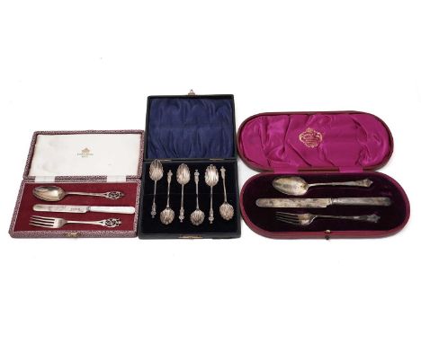 An Edwardian silver Christening knife fork and spoon in a lined and fitted red leather case, each piece initialled, by the Al