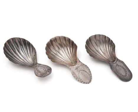 Two George III silver caddy spoons, with waisted and fluted bowls and bright-cut lug handles, both by William Bennett or Will
