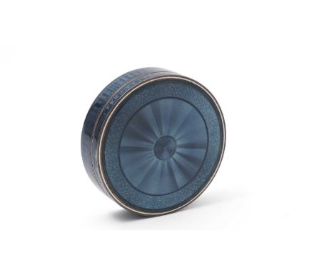 A late 19th Century French silver gilt and enamelled boxed and cover, circular, decorated with translucent steel blue enamel 