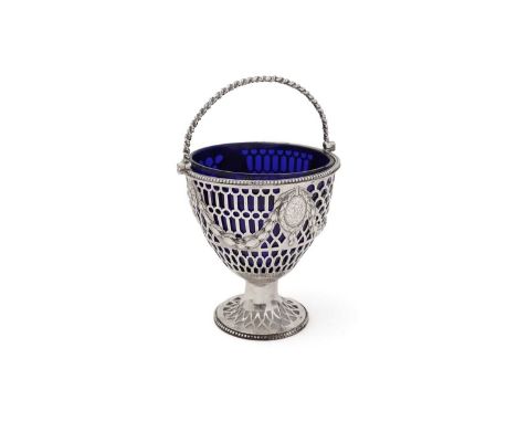 A George III silver swing handled sugar basket, with bend borders pierced decoration and embossed festoons of bell flowers an